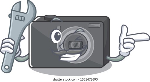 Mechanic digital camera on a cartoon table