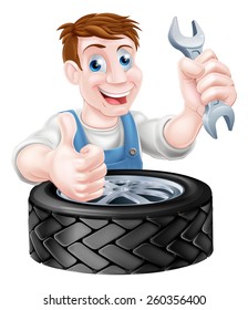 Mechanic holding spanner and giving a thumbs up behind a tyre