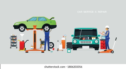 Mechanische Prüfung des Motors in der Garage mit grauem Hintergrund.
