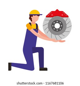 mechanic on the knee with brake disc auto part
