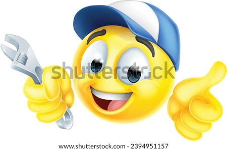 A mechanic or plumber holding a spanner or wrench emoticon face  icon