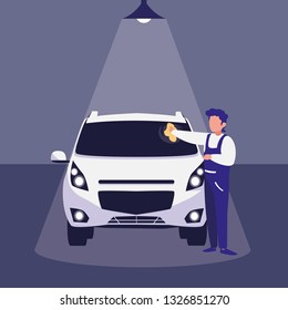 mechanic worker with car in the workshop