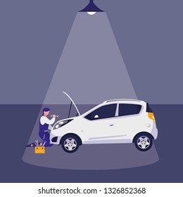 mechanic worker with car in the workshop