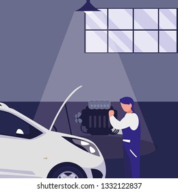 mechanic worker with car in the workshop