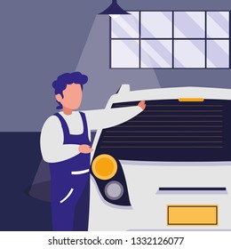 mechanic worker with car in the workshop