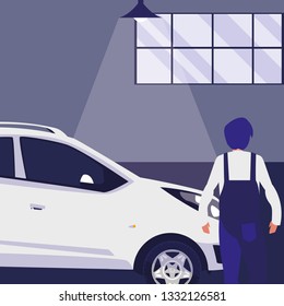 mechanic worker with car in the workshop