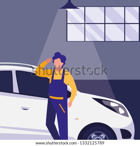 mechanic worker with car in the workshop