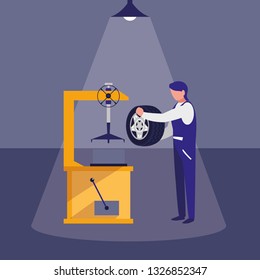 mechanic worker with tire changer machine