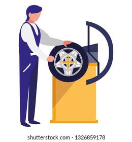 mechanic worker with tire changer machine