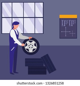 mechanic worker with tires car