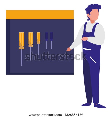 mechanic worker with tools board hanging