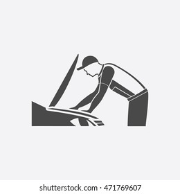 Mechanic working on a car icon. Single car repair symbol.