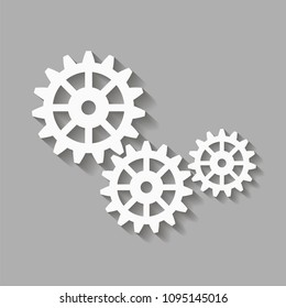 Mechanical gears with a shadow. Vector icon