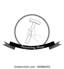 Mechanics hand with a hammer.