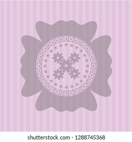 mechanism icon inside badge with pink background