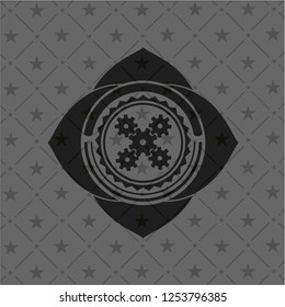 mechanism icon inside black emblem