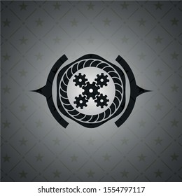 mechanism icon inside black emblem