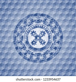mechanism icon inside blue badge with geometric background.