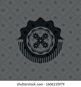 mechanism icon inside dark badge or emblem