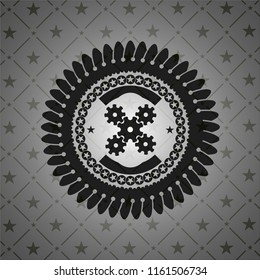 mechanism icon inside dark emblem