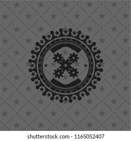 mechanism icon inside dark emblem