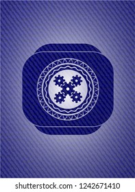 mechanism icon inside denim background