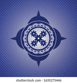 mechanism icon inside denim background