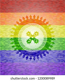 mechanism icon inside emblem on mosaic background with the colors of the LGBT flag