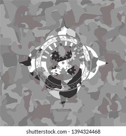 mechanism icon inside grey camo emblem