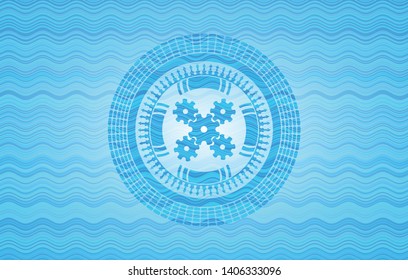 mechanism icon inside light blue water emblem.