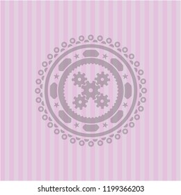 mechanism icon inside pink icon or emblem