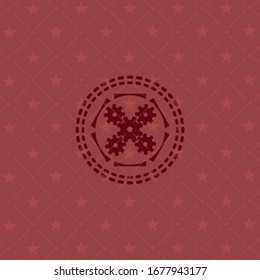icono del mecanismo dentro del emblema rojo