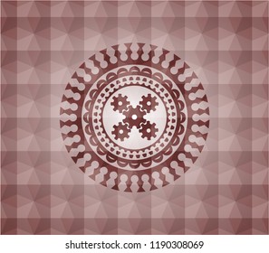 mechanism icon inside red seamless emblem or badge with geometric pattern background.