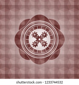 mechanism icon inside red seamless geometric emblem.