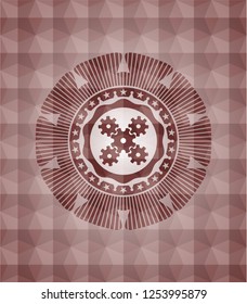 mechanism icon inside red seamless badge with geometric pattern background.