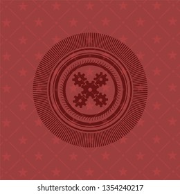 mechanism icon inside retro red emblem