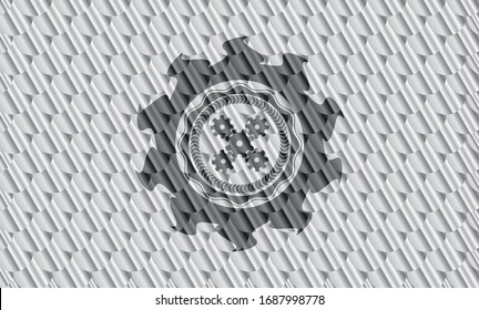 mechanism icon inside shiny silver emblem. Scales pattern. Vector Illustration. Detailed.