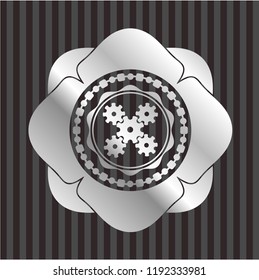mechanism icon inside silver badge or emblem