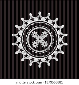 mechanism icon inside silver shiny badge