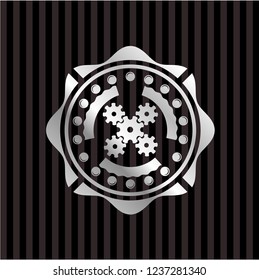 mechanism icon inside silvery shiny badge