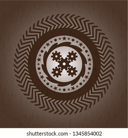 mechanism icon inside vintage wood emblem
