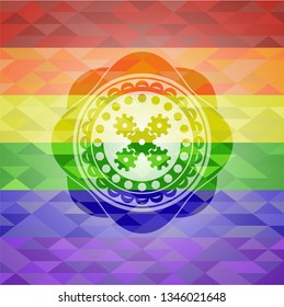 mechanism icon on mosaic background with the colors of the LGBT flag