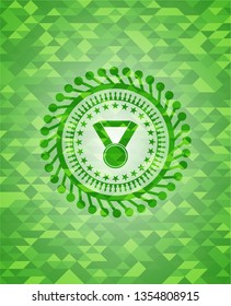 medal icon inside green mosaic emblem