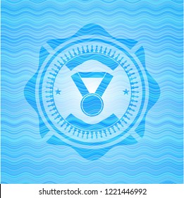 medal icon inside light blue water wave style badge.