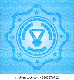 medal icon inside sky blue water wave style badge.