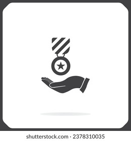 Medal on the hand Icon. Vector illustration, EPS10.