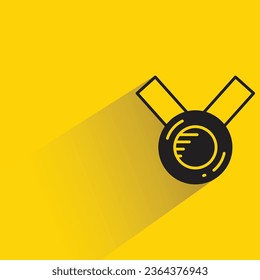 medal with shadow on yellow background