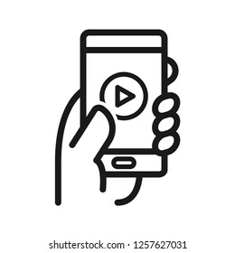 Media application mobile in hand. Simple line icon. Isolate on white background.