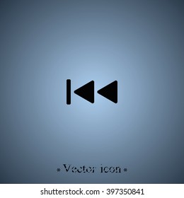 Media player control button. Rewind icon.