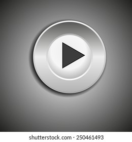 Media player interface. Play button against  dark background